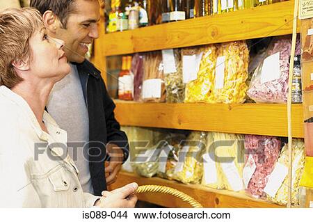Picture - Man and woman buying food. Fotosearch