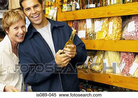Stock Photography - Man and woman buying food. Fotosearch