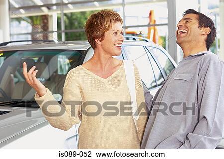 Man and woman choosing a car View Large Photo Image Stock Image - Man and woman choosing a car. Fotosearch