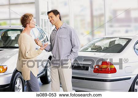 Man and woman choosing a car View Large Photo Image Stock Image - Man and woman choosing a car. Fotosearch