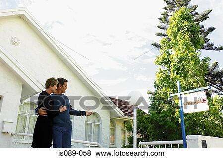 Man and woman choosing a house View Large Photo Image Stock Photo - Man and woman choosing a house. Fotosearch