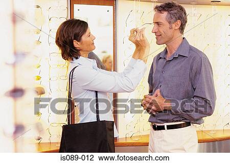 Man and woman choosing spectacles View Large Photo Image Stock Image - Man and woman choosing spectacles. Fotosearch