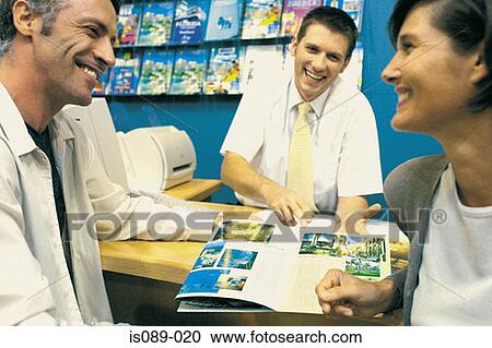 Man and woman in travel agent View Large Photo Image Stock Image - Man and woman in travel agent. Fotosearch