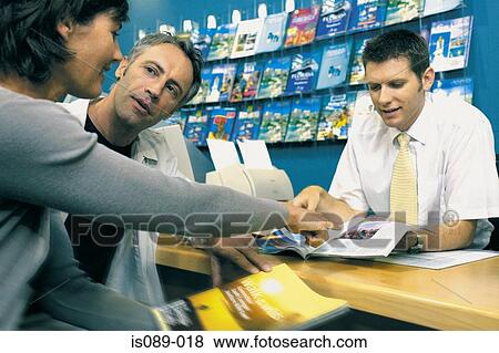 Man and woman in travel agent View Large Photo Image Stock Photo - Man and woman in travel agent. Fotosearch