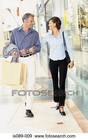 Stock Photo - Man and woman shopping. Fotosearch