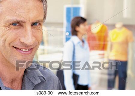 Man and woman window shopping View Large Photo Image Stock Image - Man and woman window shopping. Fotosearch