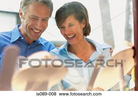 Man and woman window shopping View Large Photo Image Stock Photo - Man and woman window shopping. Fotosearch