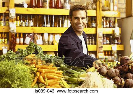Stock Image - Man buying food. Fotosearch