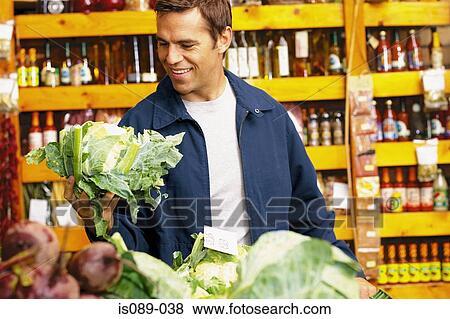 Stock Photo - Man buying food. Fotosearch