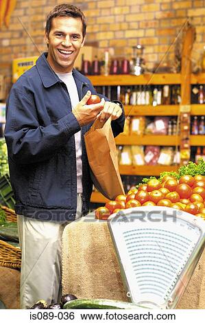 Man buying food View Large Photo Image Stock Photograph - Man buying food. Fotosearch