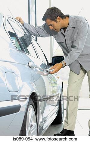 Picture - Man choosing a car. Fotosearch