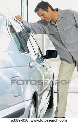 Stock Image - Man choosing a car. Fotosearch