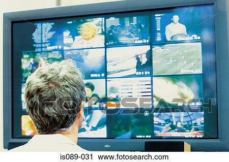 Man looking at televisions View Large Photo Image Stock Image - Man looking at televisions. Fotosearch