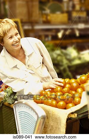 Woman buying food View Large Photo Image Stock Image - Woman buying food. Fotosearch