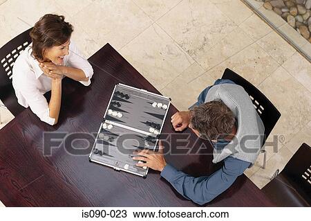 Man and woman playing backgammon View Large Photo Image Stock Image - Man and woman playing backgammon. Fotosearch
