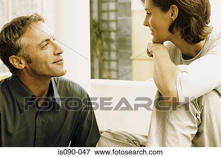 Stock Photo - Man and woman talking. Fotosearch