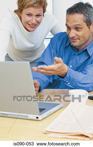 Man and woman working together View Large Photo Image Stock Image - Man and woman working together. Fotosearch