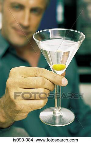 Picture - Man having a cocktail. Fotosearch