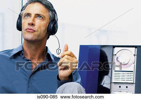 Stock Photography - Man listening to music. Fotosearch