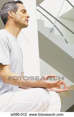 Man meditating View Large Photo Image Stock Image - Man meditating. Fotosearch