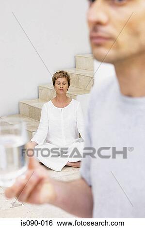 Woman meditating View Large Photo Image Stock Photograph - Woman meditating. Fotosearch