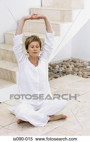 Woman meditating View Large Photo Image Stock Photography - Woman meditating. Fotosearch