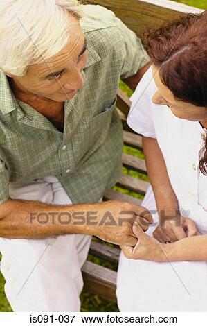Couple holding hands View Large Photo Image Stock Photo - Couple holding hands. Fotosearch