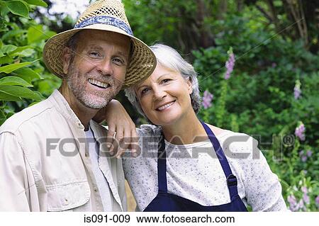 Couple in a garden View Large Photo Image Stock Photo - Couple in a garden. Fotosearch