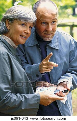 Couple with map View Large Photo Image Stock Image - Couple with map. Fotosearch
