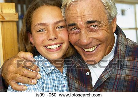 Stock Image - Grandfather and granddaughter. Fotosearch