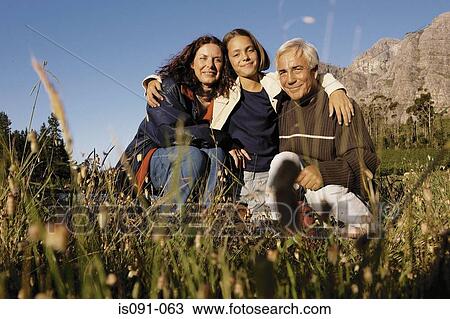Stock Image - Grandparents and granddaughter. Fotosearch
