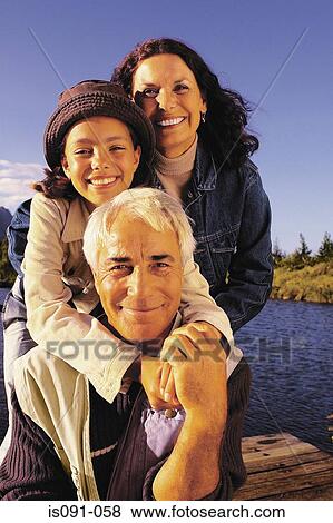 Stock Photo - Grandparents and granddaughter. Fotosearch