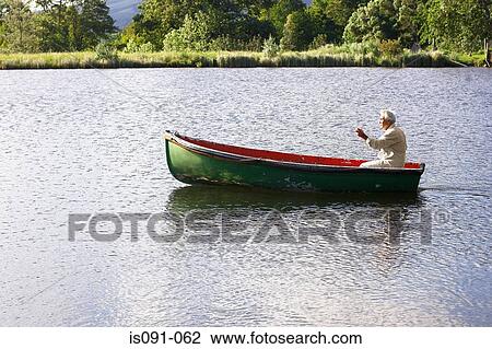 Man in boat View Large Photo Image Stock Image - Man in boat. Fotosearch