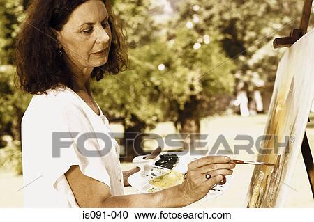 Woman painting View Large Photo Image Stock Image - Woman painting. Fotosearch