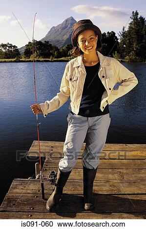 Young girl fishing on a lake View Large Photo Image Stock Image - Young girl fishing on a lake. Fotosearch