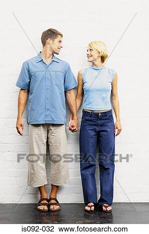 Couple standing together View Large Photo Image Stock Image - Couple standing together. Fotosearch