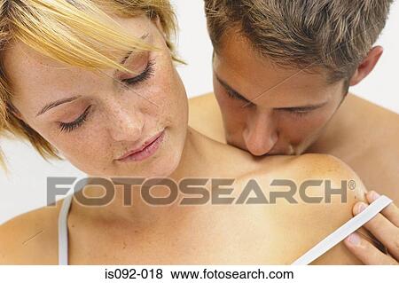 Stock Photo - Man kissing woman. Fotosearch