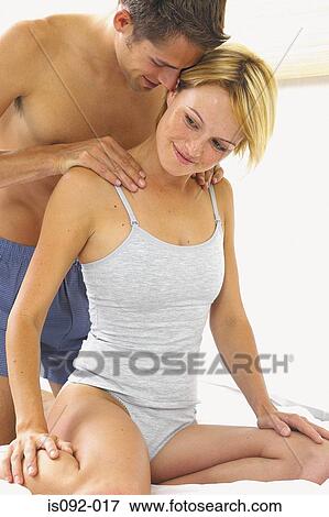 Stock Photo - Man massaging woman. Fotosearch