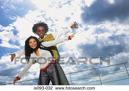 Man and woman with stormy sky View Large Photo Image Stock Image - Man and woman with stormy sky. Fotosearch