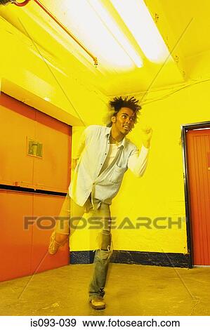 Man dancing in room View Large Photo Image Stock Photo - Man dancing in room. Fotosearch