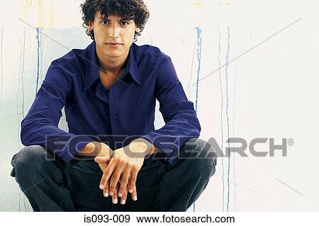 Man squatting View Large Photo Image Stock Photo - Man squatting. Fotosearch