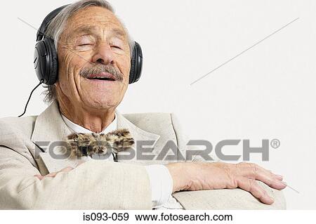 Old man listening to music View Large Photo Image Stock Photo - Old man listening to music. Fotosearch