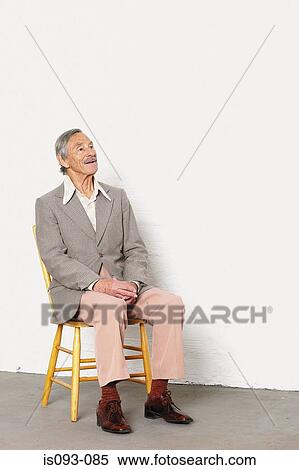 Old man on a chair View Large Photo Image Stock Photography - Old man on a chair. Fotosearch