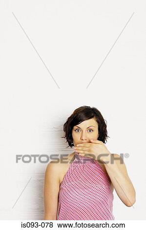 Woman covering mouth View Large Photo Image Stock Photo - Woman covering mouth. Fotosearch