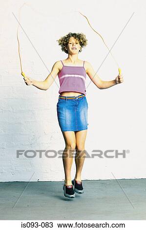 Stock Image - Woman skipping. Fotosearch