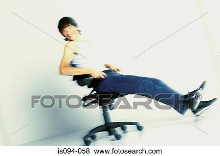 Man Leaning Back On Office Chair Stock Photo Is094 058 Fotosearch