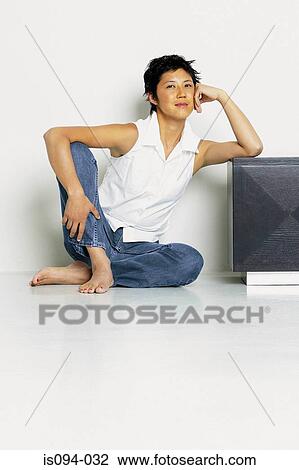 Woman sitting on floor View Large Photo Image Stock Image - Woman sitting on floor. Fotosearch