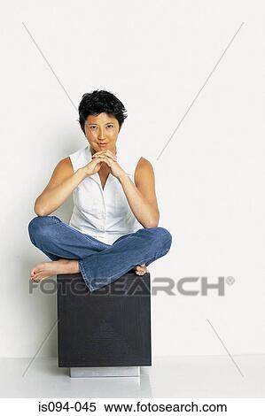 Woman sitting on stool View Large Photo Image Stock Photography - Woman sitting on stool. Fotosearch