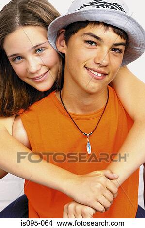 Teenage boy and girl embracing View Large Photo Image Picture - Teenage boy and girl embracing. Fotosearch