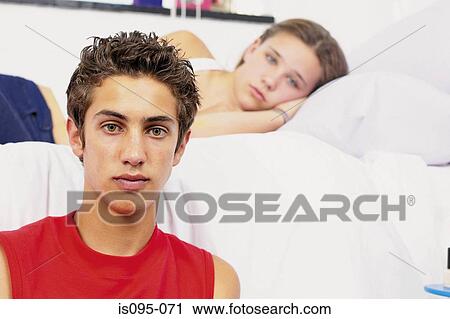 Teenage boy and girl in bedroom View Large Photo Image Stock Image - Teenage boy and girl in bedroom. Fotosearch